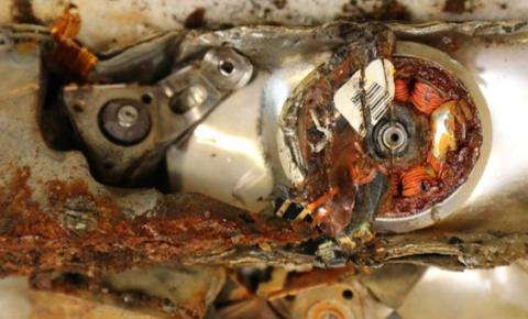 Image of some parts of shredded hard disk drives after acid-free dissolution reaction